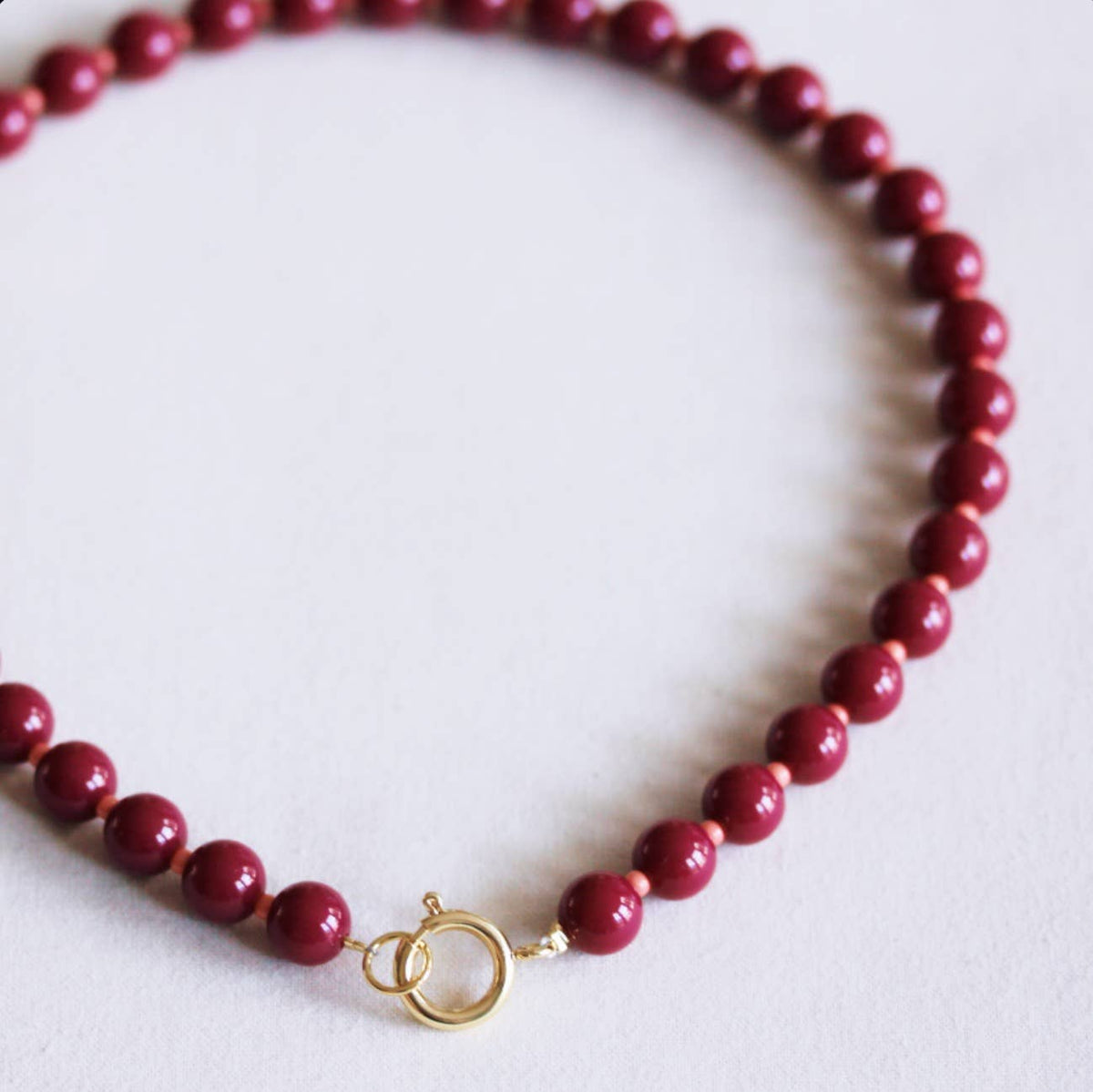 Beaded necklace with Miyukibeads with charms-burgundy/salmon
