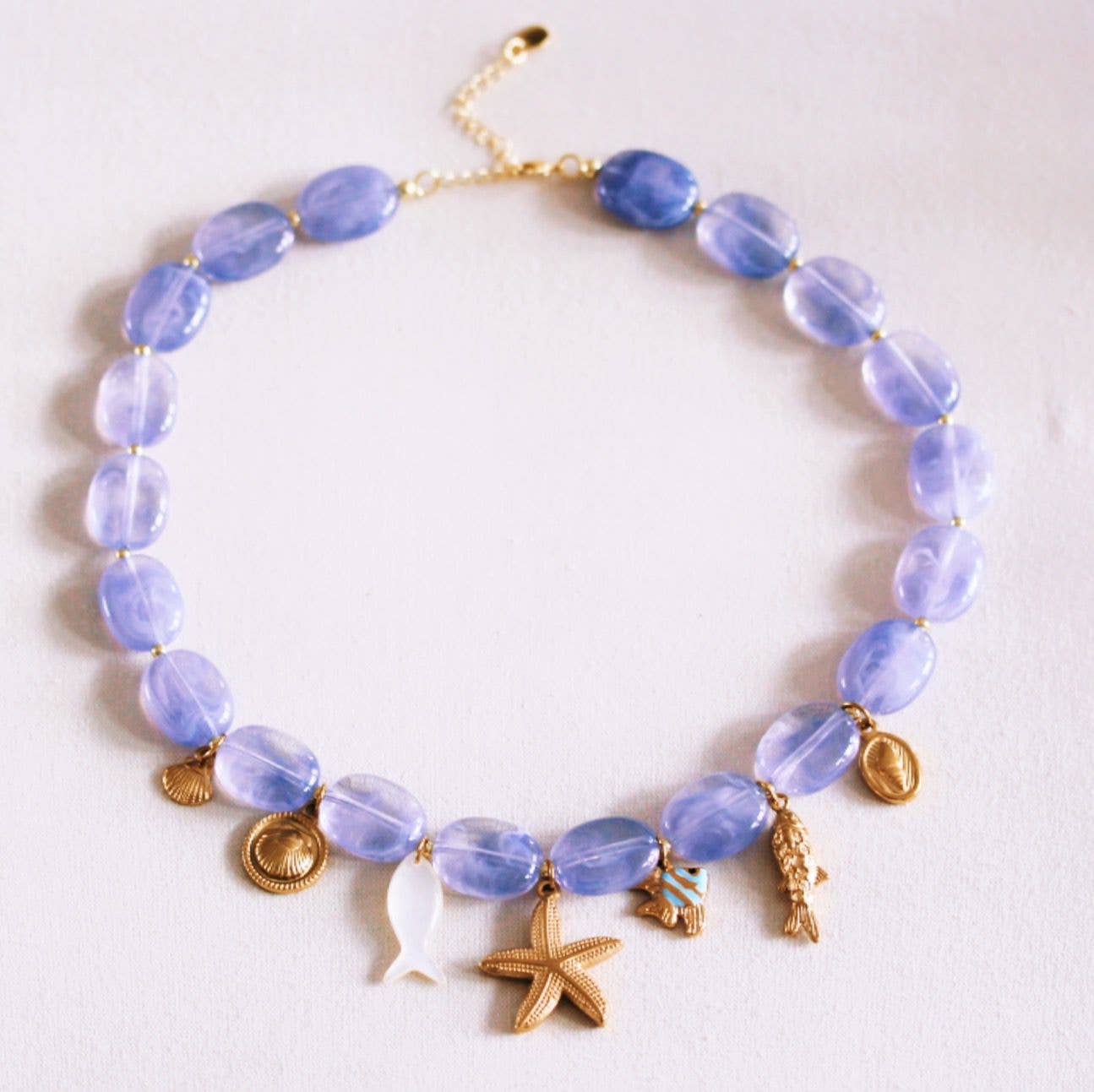 Oval beaded necklace with "Fishie's" charms