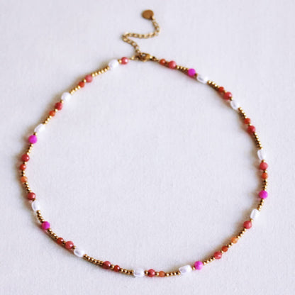 Beaded necklace with pearls and facets - coral/orange/pink